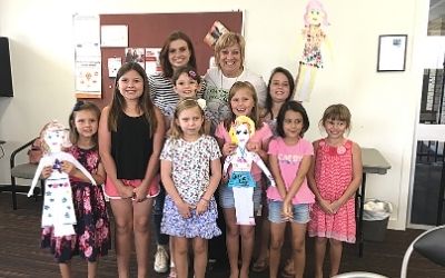 Fiona Ware sharing stories with children